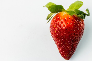 Half of strawberry isolated on white background