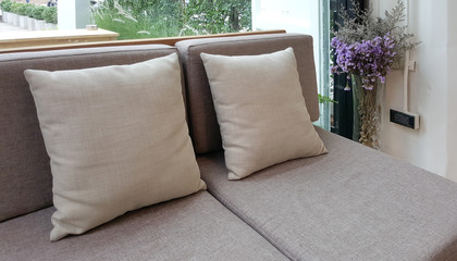 grey fabric upholstery sofa and cushion