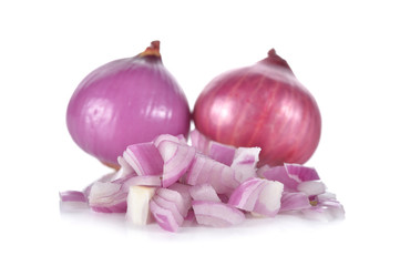 whole and chopped red onion, shallots on white background