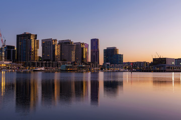 Fototapeta na wymiar Docklands, Melbourne residential buildings and Yarra waterfront at dawn