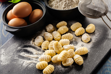 Uncooked homemade gnocchi - obrazy, fototapety, plakaty