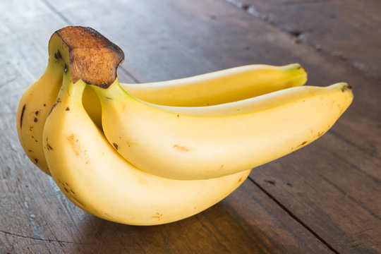 Banana on brown wooden background