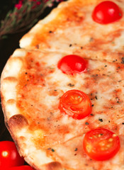 Italian pizza margherita with cherry tomatoes
