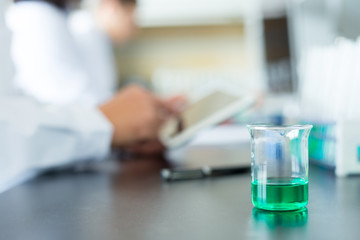 people doing chemical experiment in modern lab