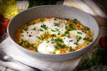 Shakshuka - traditional dish of israeli cuisine in a skillet