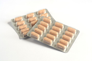 pills, tablets and drugs on white background.
