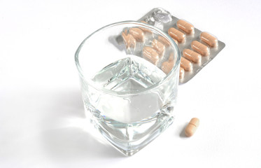 glass of water with drugs
