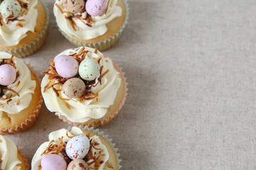 Homemade Easter eggs cupcakes,copy space background