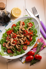 chicken salad with arugula ,tomatoes and balsamic vinegar