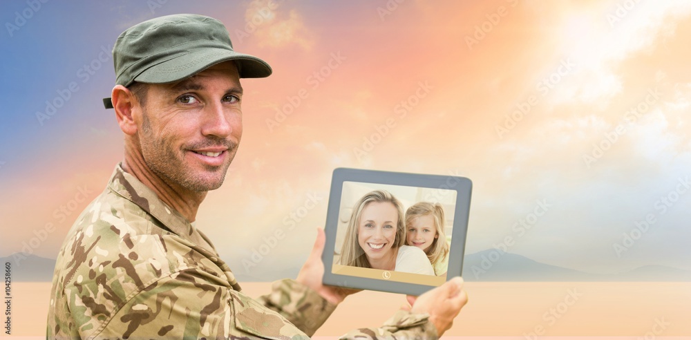 Canvas Prints Composite image of soldier using tablet pc