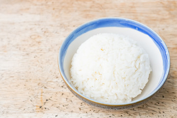Cooked jasmine rice on wooden background