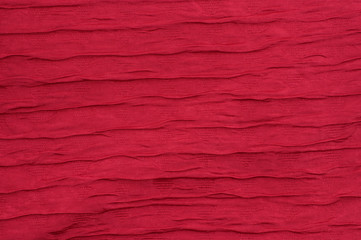 Red fabric background wave like closeup