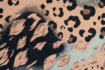 Colourful fabric with animal print background macro