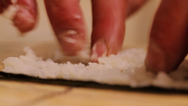 Preparing sushi rolls at home