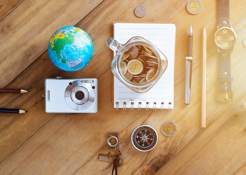 Money savings in a glass jar on wooden background, Travel concept