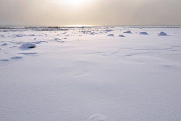 Snowy and cold winter landscape by the ocean