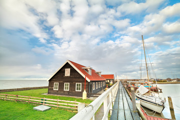yacht on harbor and blue sky in Hindeloopen