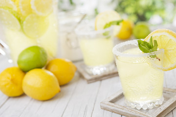 Refreshing lemonade on a rustic outdoor table in bright light
