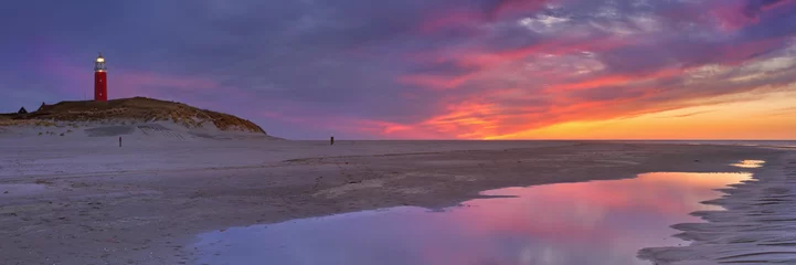 Tafelkleed Lighthouse on Texel island in The Netherlands at sunset © sara_winter