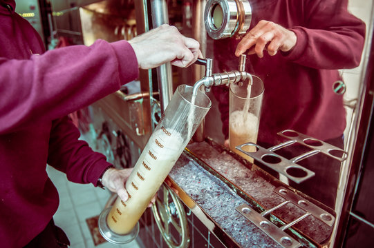 Senior man testing first beer brew