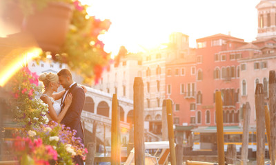 bride and groom kissing in Venice