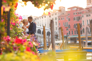 groom and bride kissing in Venice