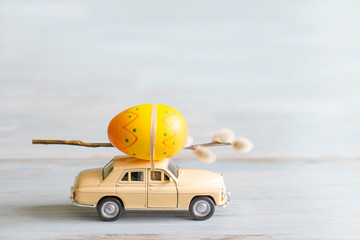 Easter eggs and catkins on car abstract retro concept