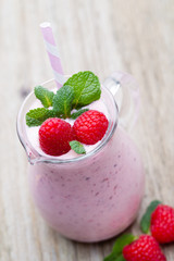 Raspberry milk shake with mint decor.