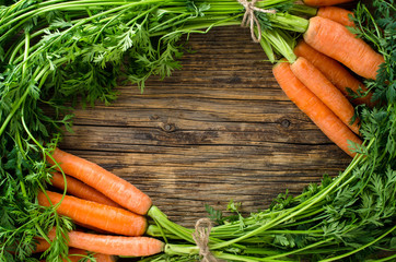 Fresh carrots on wooden table