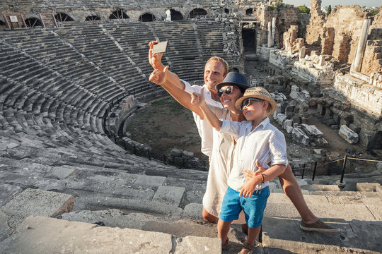 Family vacation selfie photo in antique amphitheater ruins in Si