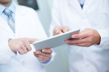 people analysis chemical experimental data with tablet