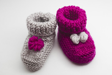 Couple knitted bootees to newborn