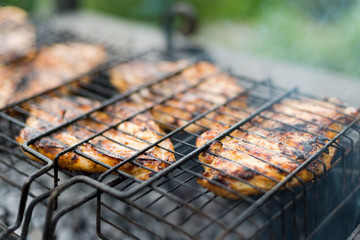 Brazier with the preparing shish kebab on a lattice