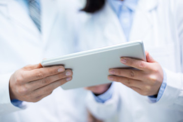 people analysis chemical experimental data with tablet