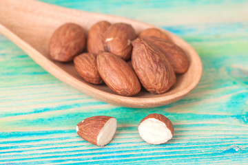 almonds on wood spoon