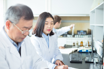 people doing chemical experiment in modern lab