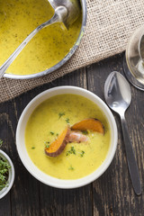 curry sweet potato soup with shrimp on vintage table