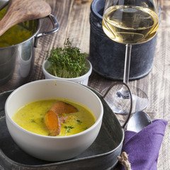 curry sweet potato soup with shrimp on vintage table