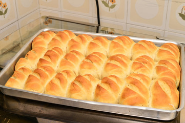 Loaf of brad made in homemade oven. Photo of full bread board