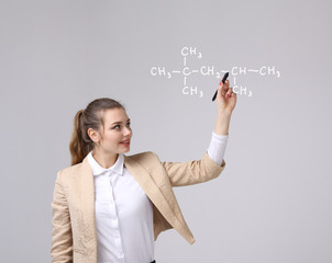 Woman chemist shows a molecular structure