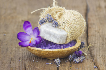 bar of natural soap, bath salt, dried lavender and crocus