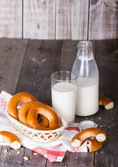 Milk and bagels on a wooden table
