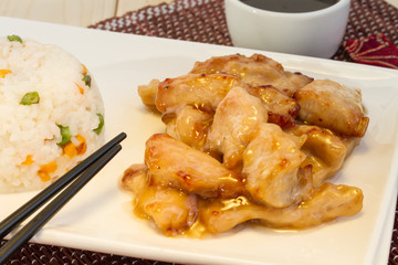 Chinese food: pork in sweet and sour sauce and rice with vegetables