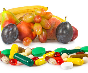 image of different fruits and pills close-up