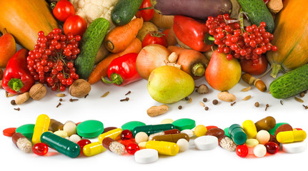 different fruits and pills closeup