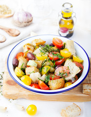 Traditional healthy Panzanella salad with fresh tomatoes and crispy bread