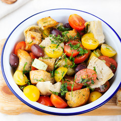 Traditional healthy Panzanella salad with fresh tomatoes Top view
