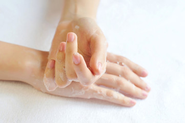 Naklejka premium Washing woman hands on a background a white towel