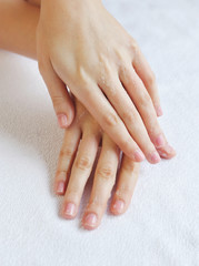 Washing woman hands on a background a white towel