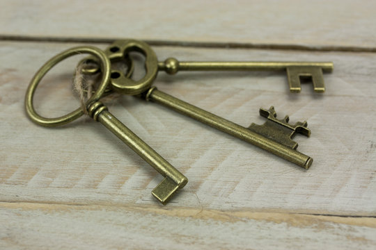 Old keys on a rustic background